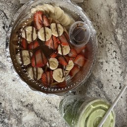 Waffles with berries, bananas and Nutella. Green apple juice. Waffles with berries, bananas and Nutella. Green apple juice.