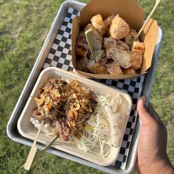 Otoshi - a person holding a tray of food - Asian Fusion Near Me - Austin, Texas Otoshi - a person holding a tray of food - Asian Fusion Near Me - Austin, Texas