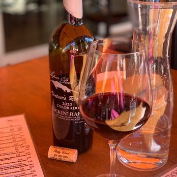 Aspen Peak Cellars - a glass of wine and a bottle of wine - Wineries Near Me - Bailey, Colorado