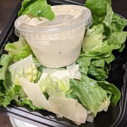 The Caesar salad was mostly and sadly salad dressing. The Caesar salad was mostly and sadly salad dressing.