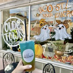 Olde Town Nutrition - Loaded tea in front of the cute shop