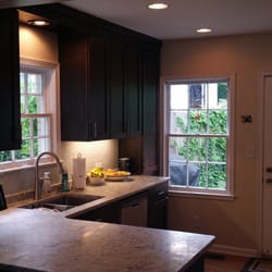Sterling Works - Winnona Park Kitchen, custom dark walnut cabinets, white/grey granite countertops, glass mini-subway tile backsplash, accent lighting