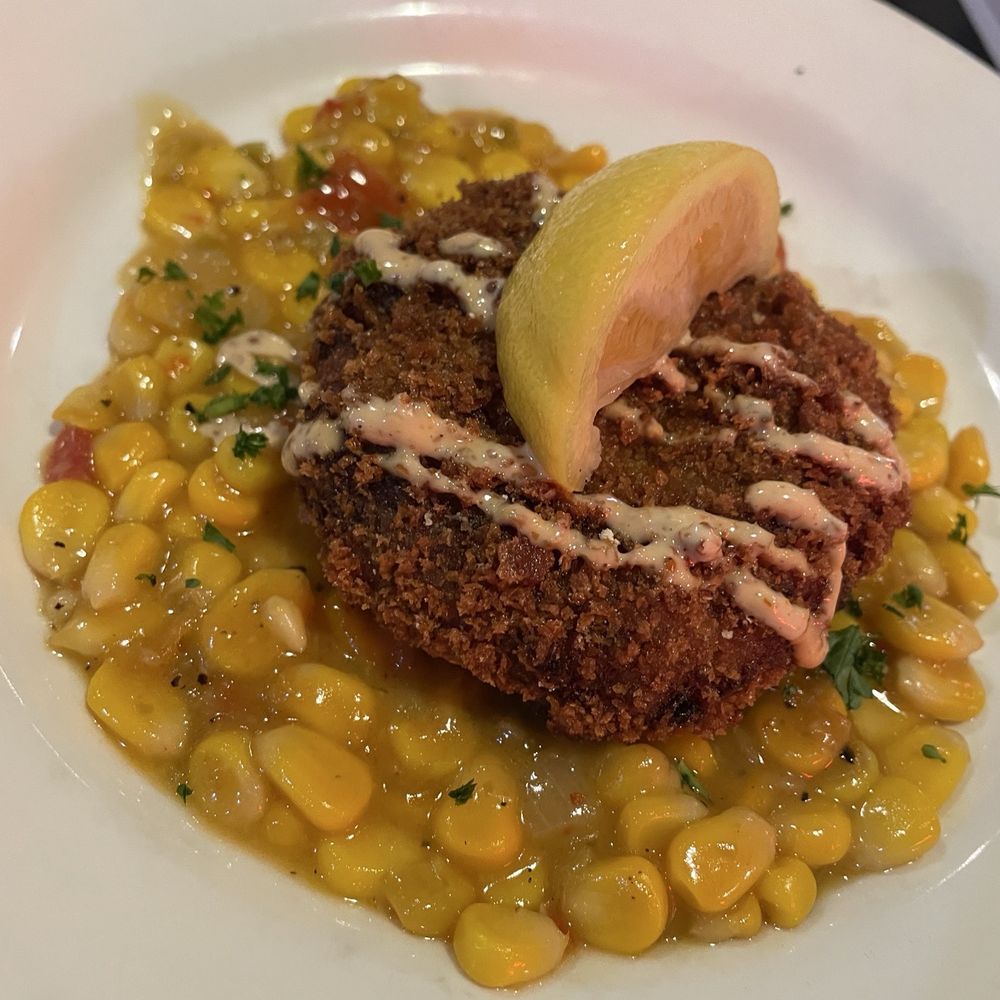 Acme Oyster House - Crab Cake with Corn Maque Choux - Seafood Near Me - Metairie, Louisiana Acme Oyster House - Crab Cake with Corn Maque Choux - Seafood Near Me - Metairie, Louisiana