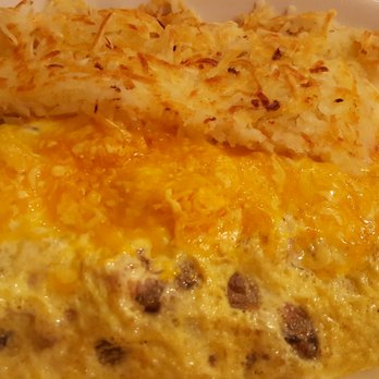 Dot Coffee Shop - Houston omelette made with eggs, sausage, ham, onions, bell peppers cheddar cheese. Hashbrowns or Grits. I got hashbrowns. $10.95. - American Near Me - Houston, Texas