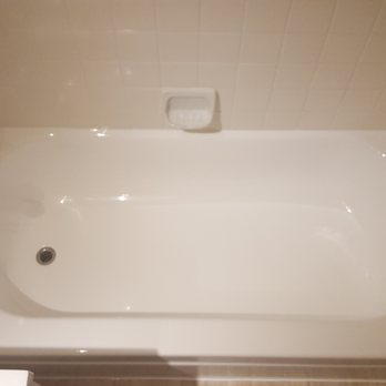 Discovery Coatings - After:  Bright white finish, no chip and re-caulked the perimeter. - Refinishing Services Near Me