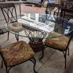 Seaquels - 70-in glass top table with beautiful base and six beautiful wrought iron chairs newly upholstered