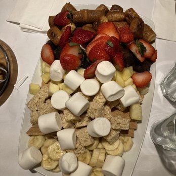 Joey Z's - Dessert chocolate fondue. Waaaaaay too much for 4 people. Go with a small sampler instead of whole thing unless you're a big party - Breakfast & Brunch Near Me - Port Jefferson, New York Joey Z's - Dessert chocolate fondue. Waaaaaay too much for 4 people. Go with a small sampler instead of whole thing unless you're a big party - Breakfast & Brunch Near Me - Port Jefferson, New York