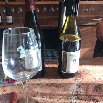 Black Knight Vineyards - two bottles of wine and a wine glass - Wineries Near Me Black Knight Vineyards - two bottles of wine and a wine glass - Wineries Near Me