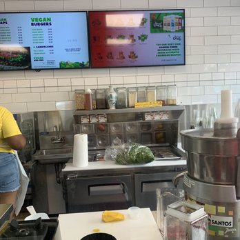 Uptown Veg 2 - a woman preparing food in a restaurant kitchen - Juice Bars & Smoothies Near Me - New York, New York Uptown Veg 2 - a woman preparing food in a restaurant kitchen - Juice Bars & Smoothies Near Me - New York, New York