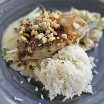 Duke's La Jolla - Sautéed Mac nut and herbed crusted fish( Mahi mahi) - New American Near Me - La Jolla, California Duke's La Jolla - Sautéed Mac nut and herbed crusted fish( Mahi mahi) - New American Near Me - La Jolla, California