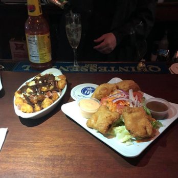 Atlantic Bar & Grill - Tater tots with homemade gravy and poutine.  Housemade reuben rolls are so flaky! - Bars Near Me - Chicago, Illinois