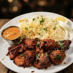 The Hyderabad Indian Grill coonrapids - Tandoori Chicken Breast Tender boneless chicken breast marinated in traditional Indian spices and yogurt, then char-grilled for that smoky t