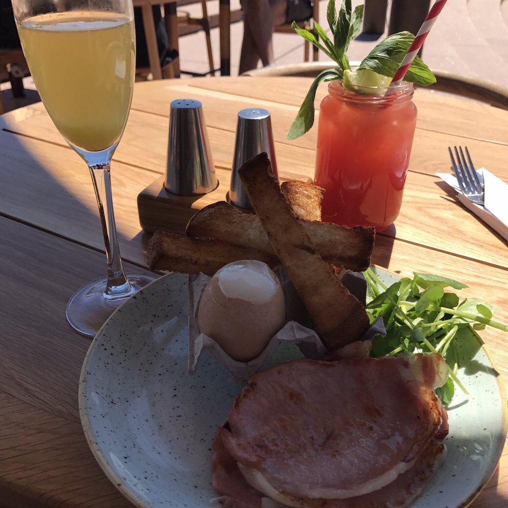 Opera Bar - Boiled egg with soldiers (kids menu) with a side of bacon. Wouldn't be complete without a mimosa! - Beer Gardens Near Me - Sydney, NSW