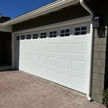 Garage Door World - White sectional garage door with widows - Garage Door Services Near Me - Sylmar, California Garage Door World - White sectional garage door with widows - Garage Door Services Near Me - Sylmar, California