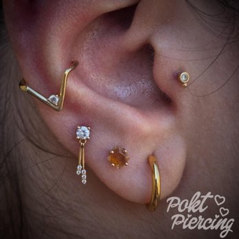 Pokt Piercing - Styled ear with yellow gold and a fully healed conch with a fun hoop. - Piercing Near Me - San Jose, California Pokt Piercing - Styled ear with yellow gold and a fully healed conch with a fun hoop. - Piercing Near Me - San Jose, California