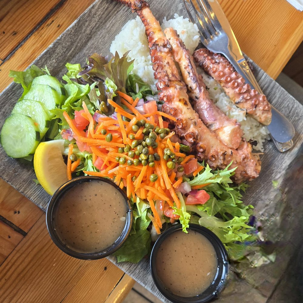 Blue Water - Grilled Octopus with rice and a side salad. Choose your marinade (garlic butter, lemon butter, teriyaki, blackened, or chipotle). - Seafood Near Me - San Diego, California Blue Water - Grilled Octopus with rice and a side salad. Choose your marinade (garlic butter, lemon butter, teriyaki, blackened, or chipotle). - Seafood Near Me - San Diego, California