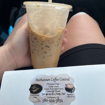 Hochatown Coffee Central - a person holding a cup of coffee - Coffee & Tea Near Me - Broken Bow, Oklahoma