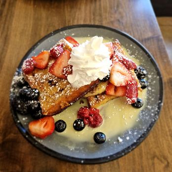 Baja Cafe - Cinnamon roll brioche French toast with a sweet cheese, vanilla sauce and sweet fruit - Breakfast & Brunch Near Me - Tucson, Arizona