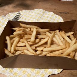 Half empty box of unsalted fries.