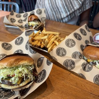The Stand - American Classics Redefined - 2 Stand Burgers and the ABC burger along with some seasoned fries. - New American Near Me - Pasadena, California The Stand - American Classics Redefined - 2 Stand Burgers and the ABC burger along with some seasoned fries. - New American Near Me - Pasadena, California