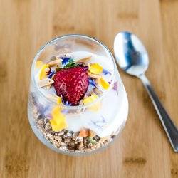 Toasted granola with yoghurt and strawberry.