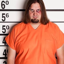 a man in an orange prison uniform a man in an orange prison uniform