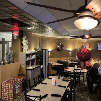 Mama Mia's - a dining room with tables and chairs - Pizza Near Me - Redford, Michigan Mama Mia's - a dining room with tables and chairs - Pizza Near Me - Redford, Michigan