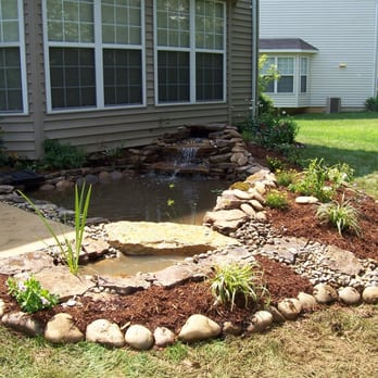 Pro Care Landsaping - a garden with a pond - Landscaping Near Me - Fenton, Missouri Pro Care Landsaping - a garden with a pond - Landscaping Near Me - Fenton, Missouri