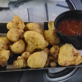 Exit Zero Filling Station - Cauliflower Bites (Flash fried cauliflower chunks, served with your choice of sauce: Sriracha-buffalo, sticky Thai, General Tso or BBQ. - Burgers Near Me - Cape May, New Jersey Exit Zero Filling Station - Cauliflower Bites (Flash fried cauliflower chunks, served with your choice of sauce: Sriracha-buffalo, sticky Thai, General Tso or BBQ. - Burgers Near Me - Cape May, New Jersey