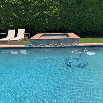 Blue Water Pools - a bicycle in the middle of the pool - General Contractors Near Me Blue Water Pools - a bicycle in the middle of the pool - General Contractors Near Me