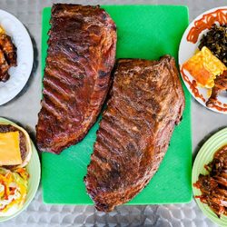 DJ's Backyard Smoking & Grill Catering - Two Full Slabs Of Ribs With Plates Display We Made Around Them