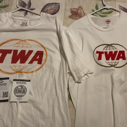 Malibu t-shirt on left. Other branded t-shirt purchased at TWA hotel at JFK on right.