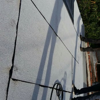 CRB Handyman - a person standing on a roof - Painters Near Me CRB Handyman - a person standing on a roof - Painters Near Me