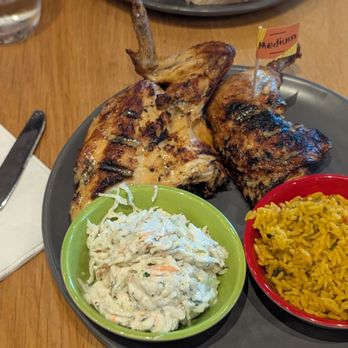 Nando's Peri-Peri - Half chicken with Coleslaw and Rice - South African Near Me - Fairfax, Virginia Nando's Peri-Peri - Half chicken with Coleslaw and Rice - South African Near Me - Fairfax, Virginia