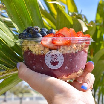 Playa Bowls - a hand holding a bowl of fruit - Juice Bars & Smoothies Near Me - Flemington, New Jersey Playa Bowls - a hand holding a bowl of fruit - Juice Bars & Smoothies Near Me - Flemington, New Jersey