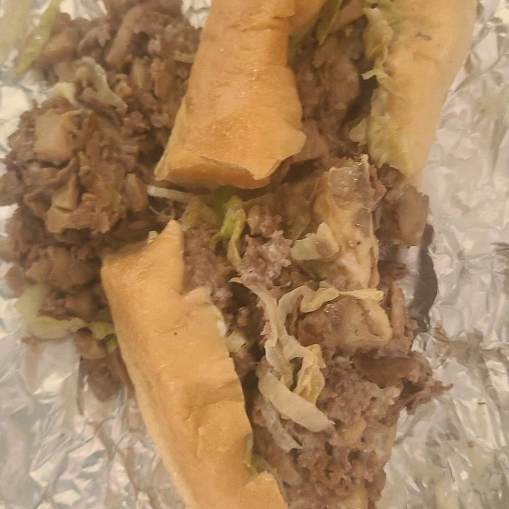 a sandwich with meat and vegetables a sandwich with meat and vegetables