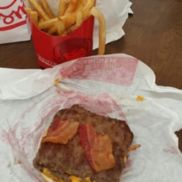 a burger and french fries on a table a burger and french fries on a table