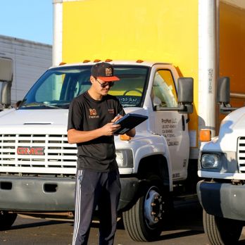 ProMen - A team member carefully preparing the necessary paperwork to ensure an organized and efficient moving process. - Movers Near Me - San Diego, California ProMen - A team member carefully preparing the necessary paperwork to ensure an organized and efficient moving process. - Movers Near Me - San Diego, California