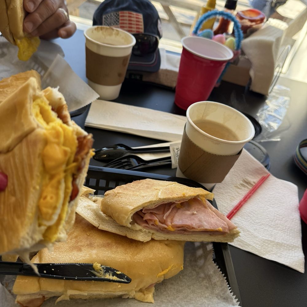 Bacon, egg and cheese sandwich and the ham and cheese press. Amazing coffee!!! Bacon, egg and cheese sandwich and the ham and cheese press. Amazing coffee!!!