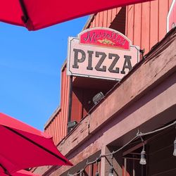 Martolli's - There main sign Authentic Hand Tossed Pizza .