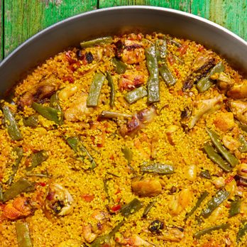 Deliberico - a pan of food on a wooden table - Specialty Food Near Me - Doral, Florida Deliberico - a pan of food on a wooden table - Specialty Food Near Me - Doral, Florida