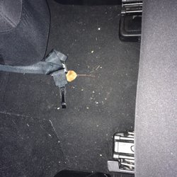 Clean Getaway - Trash behind passenger front seat.