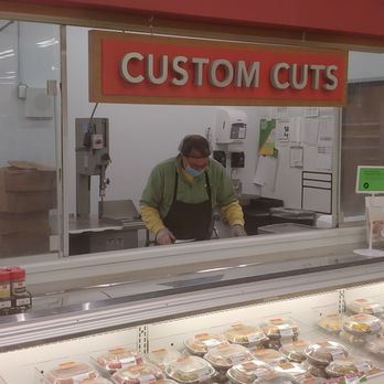 Publix Super Markets - Butcher cutting up meat. - Grocery Near Me - Bethlehem, Georgia