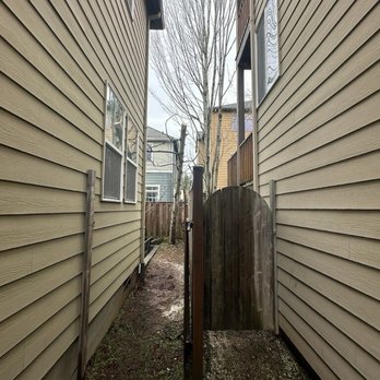 Milton Cleanup & More - tree was left in a way where a good gust during storm would bring it down on the fence - Landscaping Near Me