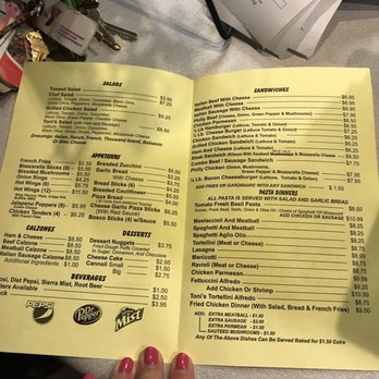 Toni's Pizza - a hand holding a menu - Pizza Near Me - Machesney Park, Illinois Toni's Pizza - a hand holding a menu - Pizza Near Me - Machesney Park, Illinois