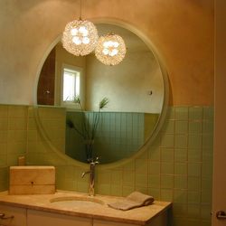 GlassArt Design - We can cut mirror to any shape to fit your space. The frosted panel behind this mirror adds softness to a modern shape and hardware.