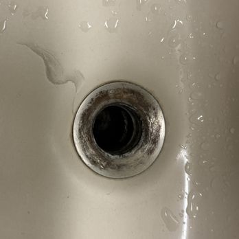 Crown Point Condominiums - Damaged and corroded main bathroom sink and drain - Hotels Near Me - Ruidoso, New Mexico Crown Point Condominiums - Damaged and corroded main bathroom sink and drain - Hotels Near Me - Ruidoso, New Mexico