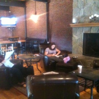 Bonhoeffer's Cafe & Espresso - Six leather armchairs, fireplace, two tables with pew seats, and many standing height tables. - Coffee & Tea Near Me - Nashua, New Hampshire