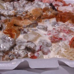 Lamb & Chicken Combo with rice and salad. Say YES to the white and red sauce! Lamb & Chicken Combo with rice and salad. Say YES to the white and red sauce!