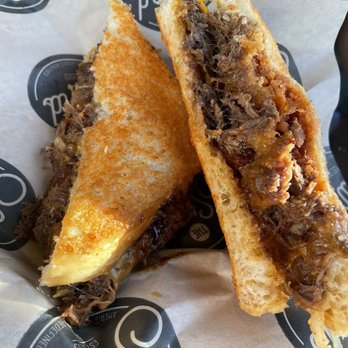 The Stand - American Classics Redefined - Braised Short Rib Grilled Cheese. $12.95 (10/18/22) Parm crusted bread, fried onion strings and hickory sauce. HUUGE! - New American Near Me - Valencia, California The Stand - American Classics Redefined - Braised Short Rib Grilled Cheese. $12.95 (10/18/22) Parm crusted bread, fried onion strings and hickory sauce. HUUGE! - New American Near Me - Valencia, California